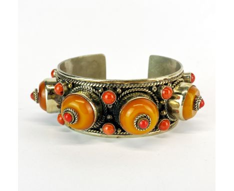 A Tibetan tribal bangle, W. 3cm, Dia. 7.5cm.