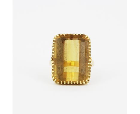 An 18ct yellow gold ring set with a large emerald cut citrine, 2 X 1.5cm, (O).