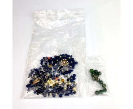 A quantity of mixed blue beads and clasps with green jade for restringing.