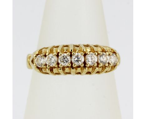 A 14ct yellow gold ring set with white stones, (K).