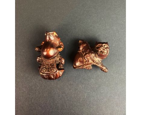 Two carved fruitwood figures/netsuke of a frog and a tiger, H. 6cm.