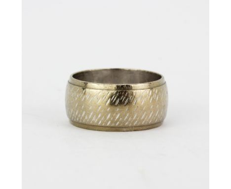 An 18ct white gold wedding band, (K), approx. 8.2gr.