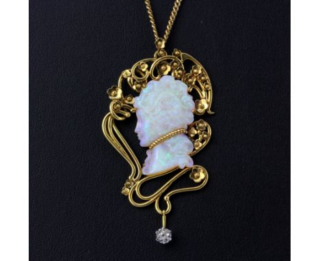 An 18ct yellow gold necklace set with a carved opal and an old cut diamond, L. 6.5cm.