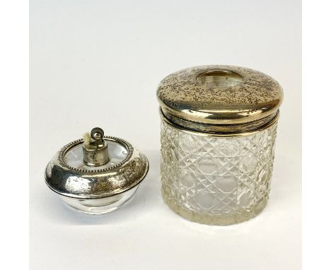 A sterling silver and glass Frank M. Whiting patent table lighter, Dia. 6cm. together with a hallmarked silver topped cut gla