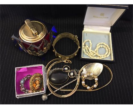 A volume of costume jewellery and a kitsch Colibri table lighter