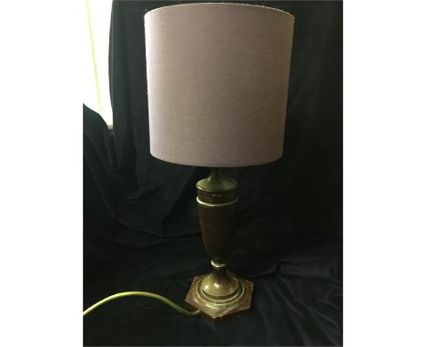 A mahogany lamp base with purple shade