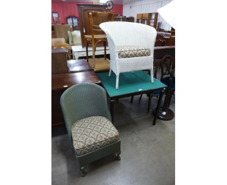 Two wicker chairs and a folding card table 