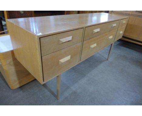 A small light oak sideboard 