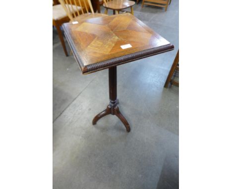 A Victorian oak tripod table 