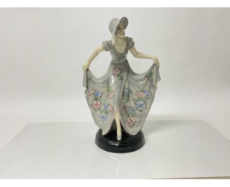 Stefan Dakon for Goldscheider a 1930's Art Deco figure of a lady in pretty dress, impressed and printed marks to base, 31.5cm