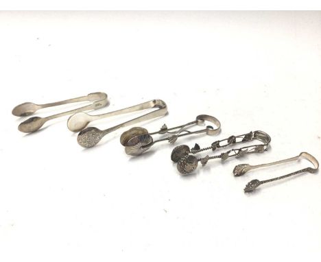 Five pairs of Chinese and Japanese silver and white metal sugar tongs, to include Wang Hing, Yat Sun and others, all at appro