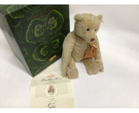 Steiff Bear 2001/02 Xenia 660467 and 1992 Harrods Musical Bear 011924 . Both boxed with certificates. The Harrods box has no 