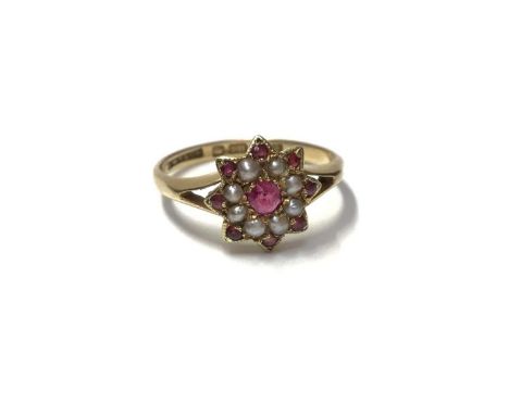 Edwardian 18ct gold ruby and seed pearl flower head cluster ring (Birmingham 1908), size KWeight 2 grams