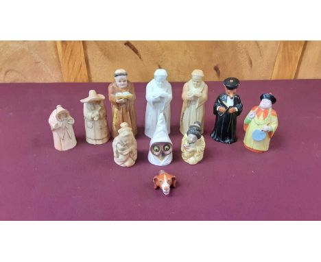 Royal Worcester dog's head whistle, together with nine Royal Worcester candle snuffers including Owls head, Monk etc (10)Whis