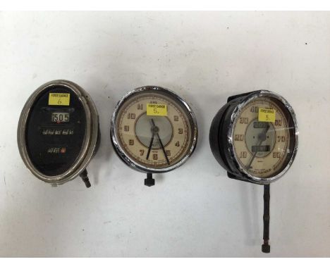 Three boxes automobilia including car speedos, clocks, badges, grease guns, inspection lamp etc
