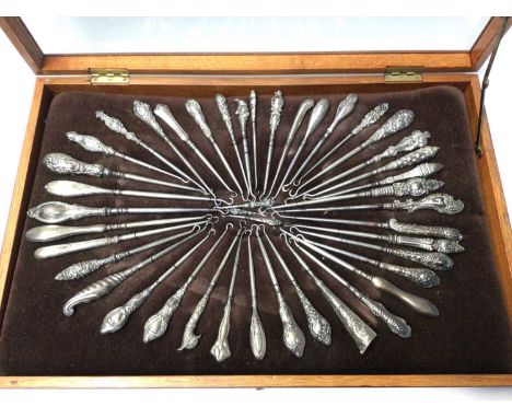 Collection of approximately 40 Victorian and Edwardian silver handled button hooks including a novelty 'Punch' button hook, w