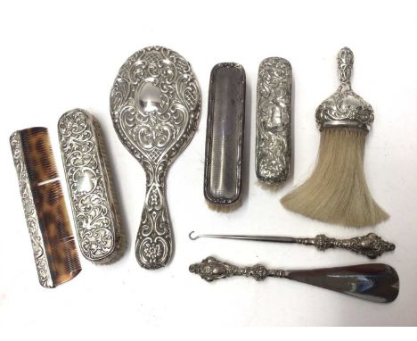 Group silver backed dressing table items to include brushes, hand mirror, comb, button hook and shoe horn