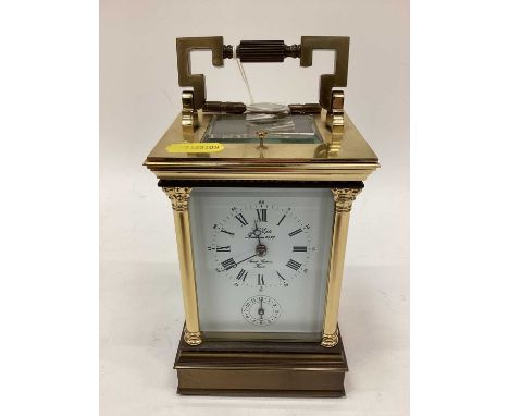 Large brass cased carriage clock and key with Corinthian column decoration, the dial signed 'Saint Suzanne France', 19.5cm hi