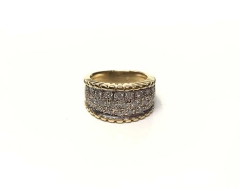 18ct gold diamond set thick band ring with twenty nine brilliant cut diamonds in millegrain setting, size K½Weight 9.1 grams