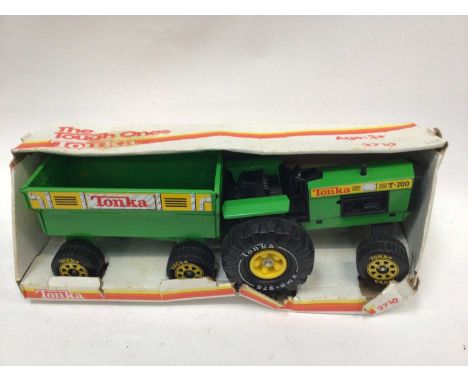 Three boxed Tonka Toys, Japanese Battery Operated Tractor and Ertl Toys Are Us Lorry.