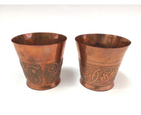 Pair of Arts &amp; Crafts copper beakers by Keswick School of Industrial Arts, with foliate decoration, stamped marks, 10cm h