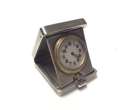 George V Art Deco silver travelling time piece, mounted in a folding easel stand case with engine turned decoration, (Birming