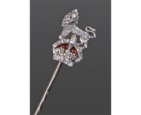 Diamond set stick pin, with a diamond set lion above a crown, 70mm long