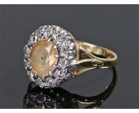 18 carat gold diamond and citrine ring, the central citrine with a diamond surround, ring size K 1/2