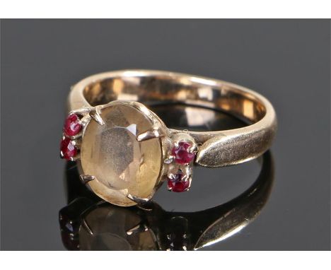 18 carat gold citrine and ruby set ring, the central citrine with ruby edge, ring size M 1/2