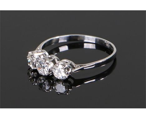 Platinum and diamond set ring, the head set with three round cut diamonds, ring size P