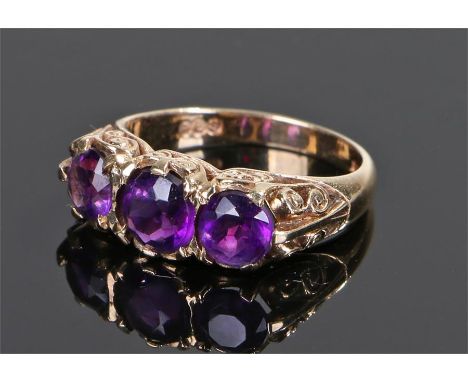 9 Carat amethyst ring,  the head set with three round cut amethyst, ring size O