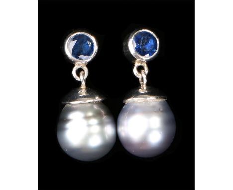 Pair of platinum sapphire and pearl earrings, the circular grey pearls at approximately 10mm diameter each surmounted by a ro