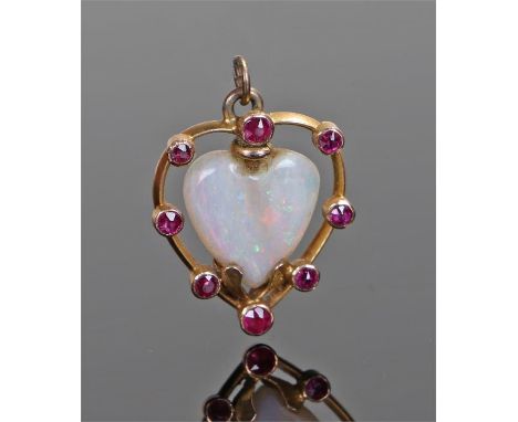 Opal and ruby heart pendant, the central opal carved as a heart with round cut ruby surround, 14mm diameter 