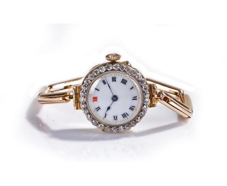 18 carat gold diamond set ladies wristwatch, the white enamel dial with Roman hours, diamond set bezel, with an attached 9 ca