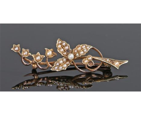 15 carat gold pearl set brooch, in the form of flowers, 45mm long