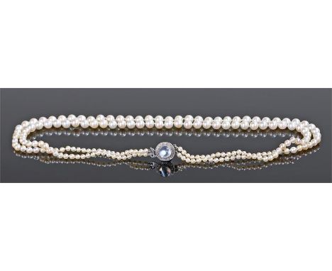 Pearl and moonstone necklace, with a graduated two strand pearl necklace with a diamond and moonstone clasp, the total length