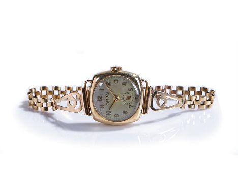 Yeoman 9 carat gold ladies wristwatch, the signed silvered dial with Arabic hours and subsidiary seconds, manual wound, with 