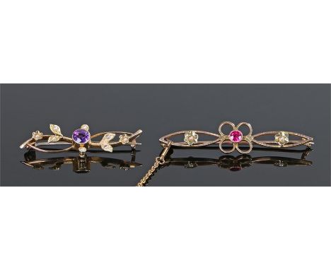 Two brooches, the first with a central amethyst and pearl set leaf design, the second with a central ruby and pearl set edge,