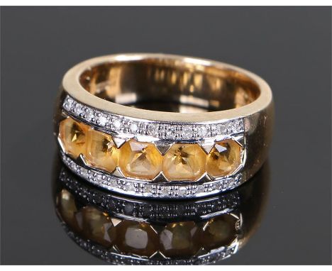 9 carat gold ring, set with a row of citrine with a diamond surround, ring size P