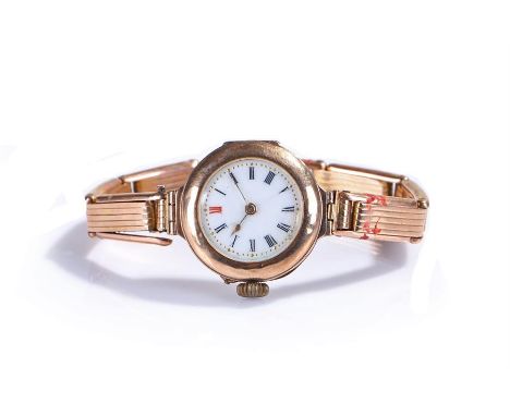 9 carat gold ladies wristwatch, the white enamel dial with black Roman hours, manual wound, the case 28mm diameter 