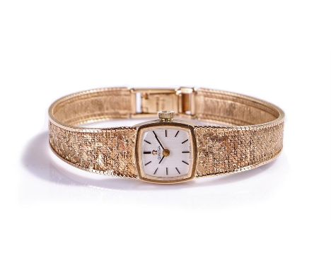 Omega 9 carat gold ladies wristwatch, the signed silvered dial with baton hours, manual wound, the case 15mm diameter, with a