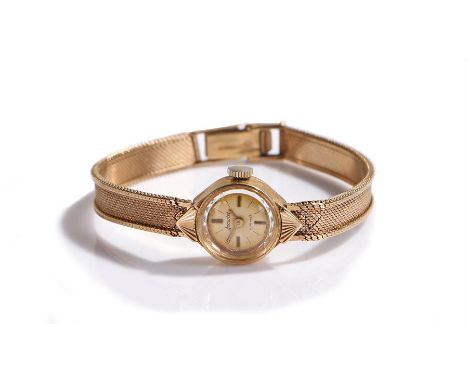 Accurist 9 carat gold ladies wristwatch, the signed dial with baton markers, manual wound, with a 9 carat gold strap, the cas