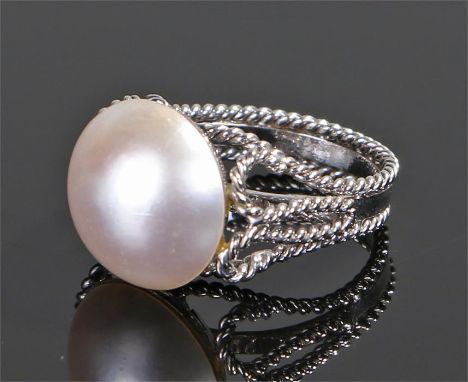 Pearl set ring, with a half pearl above the white metal shank, ring size M