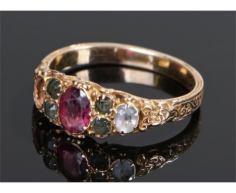 19th Century garnet and white sapphire set ring, the central red garnet flanked by green garnets and a white sapphire (one mi