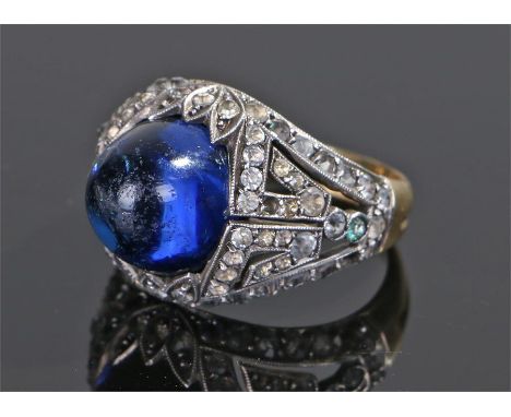 Yellow metal ring, set with a blue stone to the white head and yellow metal shank, ring size P
