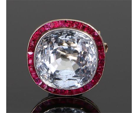 Colourless topaz and ruby brooch, the central topaz with ruby surround, 17mm diameter 