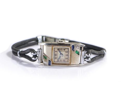 18 carat white gold emerald diamond and sapphire set ladies wristwatch, the rectangular case set with emeralds, diamonds and 