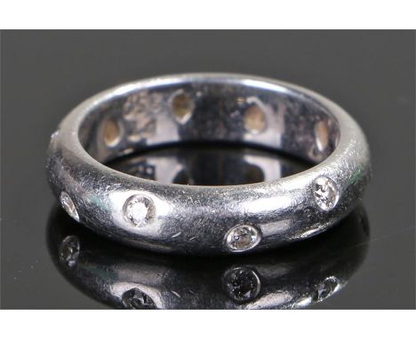 Tiffany & Co, a diamond set band ring, the band set with ten round cut diamonds to the shank, together with the box, ring siz