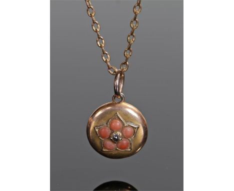 Victorian coral and agate set pendant, the oval pendant set with a central diamond and coral surround backed by an agate, the