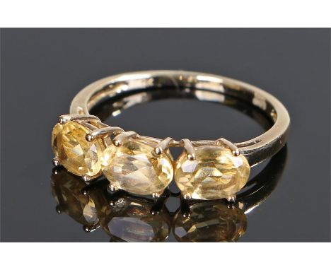 9 carat gold and citrine ring, the head set with three oval cut citrines, ring size O